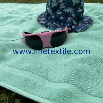Wholesale high quality cotton embossed jacquard custom logo hotel bath beach towel